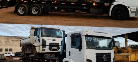 Guincho plataforma em Abadia de Goiás transportando caminhão branco com caçamba.
